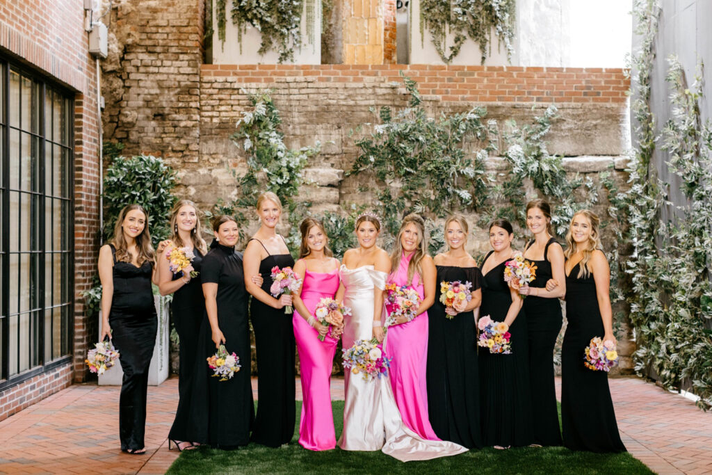 Bride with bridesmaids at The Fitler Club in black & hot pink bridesmaid dresses