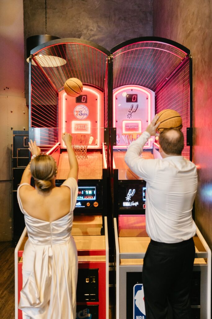 Bride & groom playing at The Fitler Club during their wedding reception