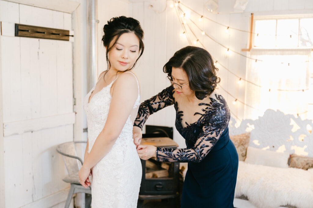 bride getting read with her mother before her fall wedding in Glen Mills, Pennsylvania