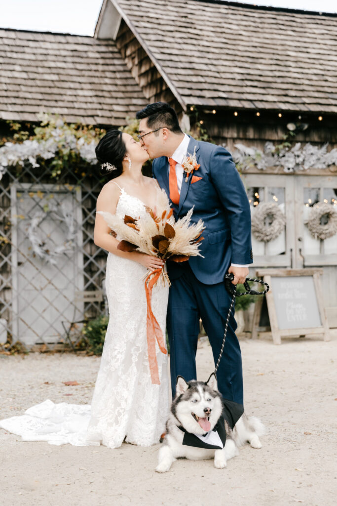 bride & groom portrait with their pet dog at Terrain at Styer's