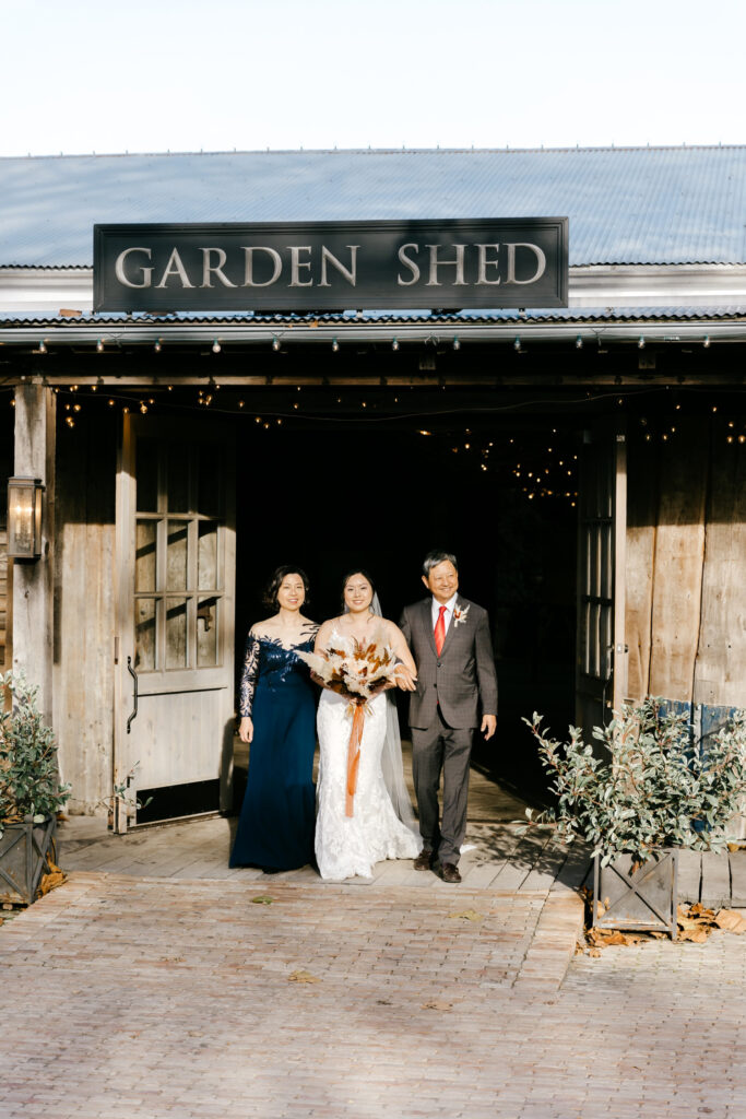 bride walking down the aisle at Terrain at Styer's during Pennsylvania wedding