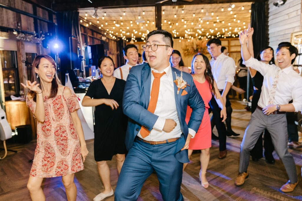 groom dancing during Fall wedding reception in Pennsylvania