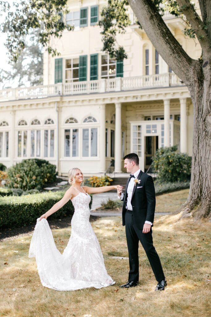 bride & groom outside Glen Foerd manison in the summer by Emily Wren Photography