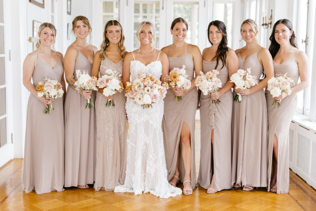 bride with her bridesmaids in their mauve bridesmaid dresses for summer Glen Foerd wedding day