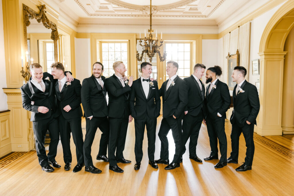 groom with groomsmen inside Glen Foerd mansion by Emily Wren Photography