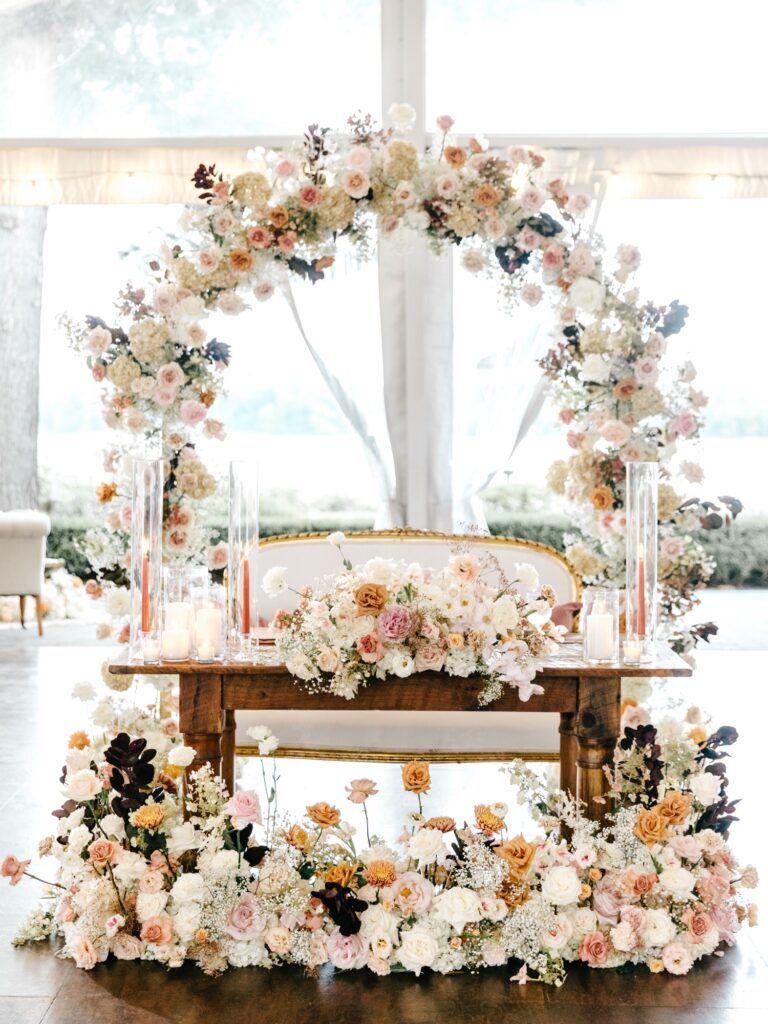 summer floral sweethearts table arch at Glen Foerd wedding reception by Emily Wren Photography