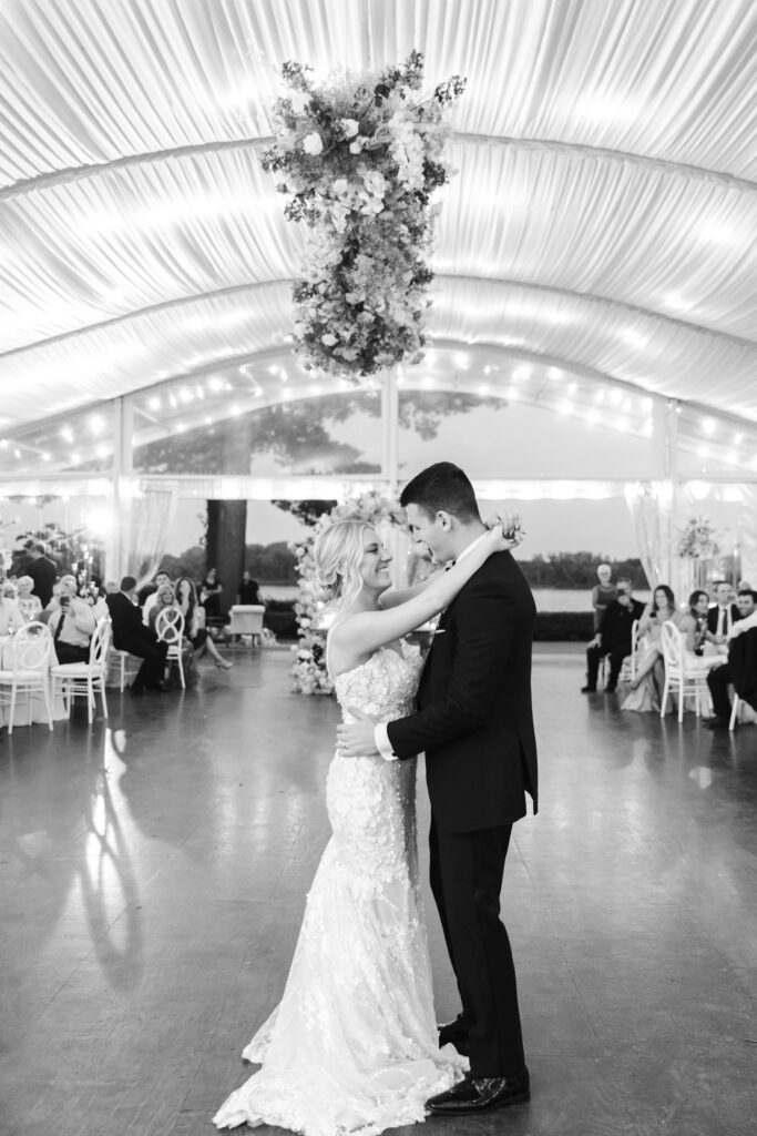 bride & grooms first dance under white tented wedding reception at Glen Foerd