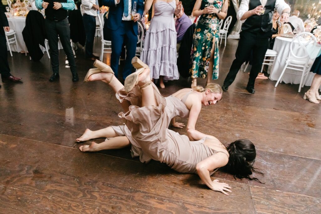 bridesmaids funny entrance at Glen Foerd Wedding reception by Philadelphia Wedding photographer Emily Wren Photography