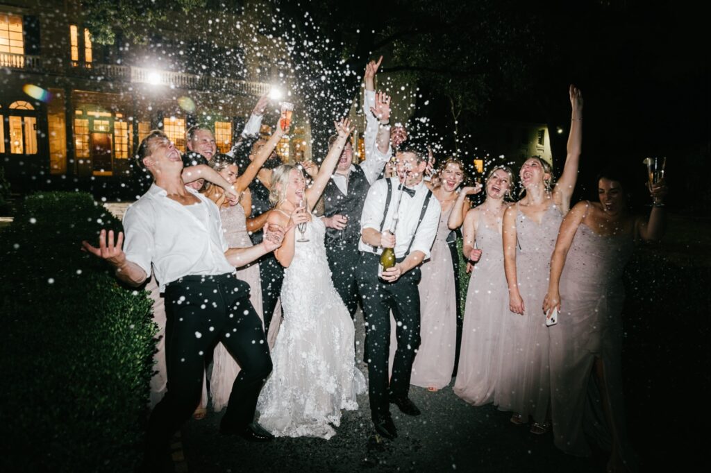 bride & groom champagne pop at Glen Foerd wedding reception by Emily Wren Photography