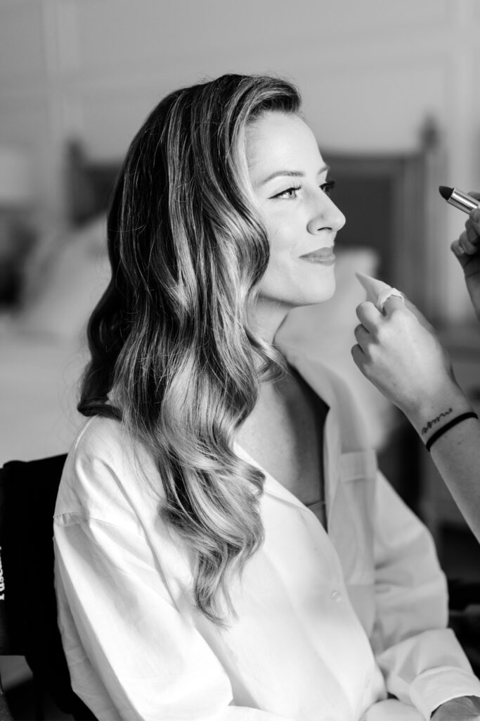 bride getting her makeup done for June Pennsylvania wedding