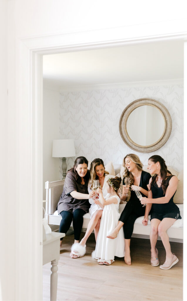 bride with bridesmaids before June garden wedding