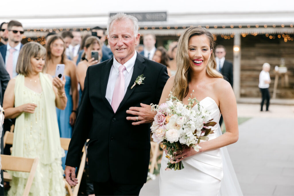 bride walking down the aisle during June Terrain wedding