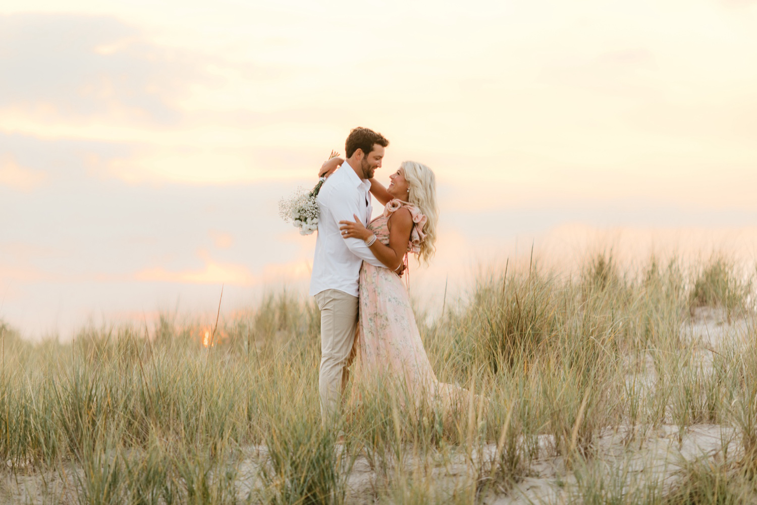 engagement photos during sunset on the beach by Emily Wren Photography