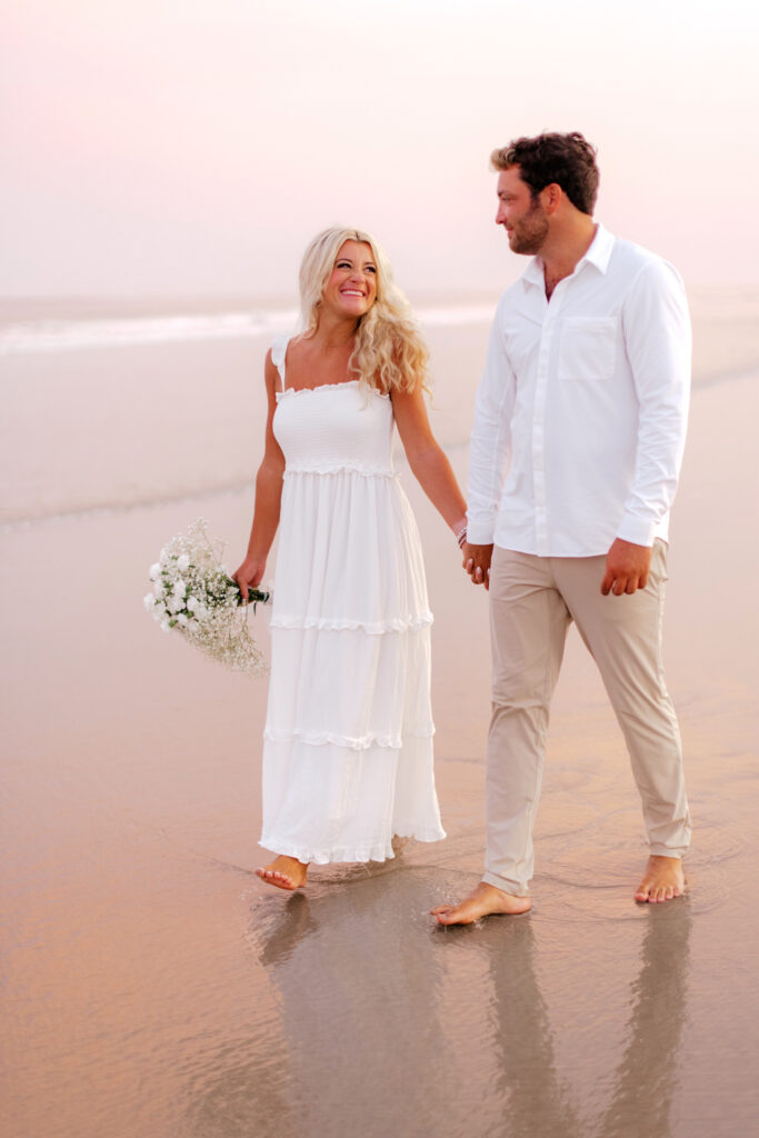engagement photoshoot during pink sunset on the beach by Philadelphia portrait photographer Emily Wren Photography