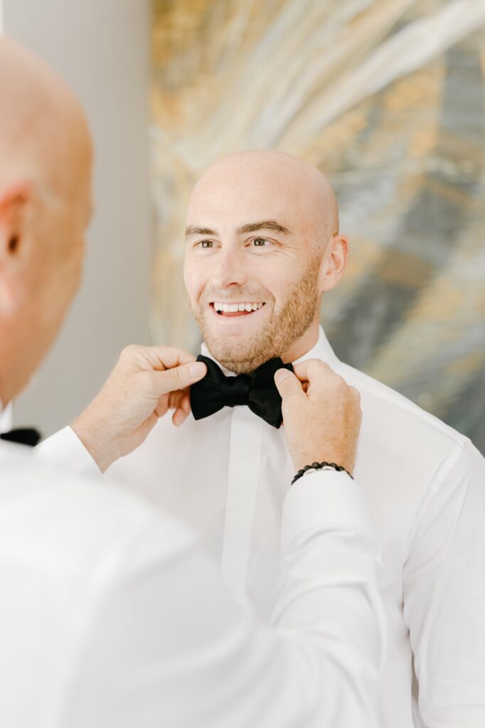 groom getting ready for his Philadelphia summer wedding day