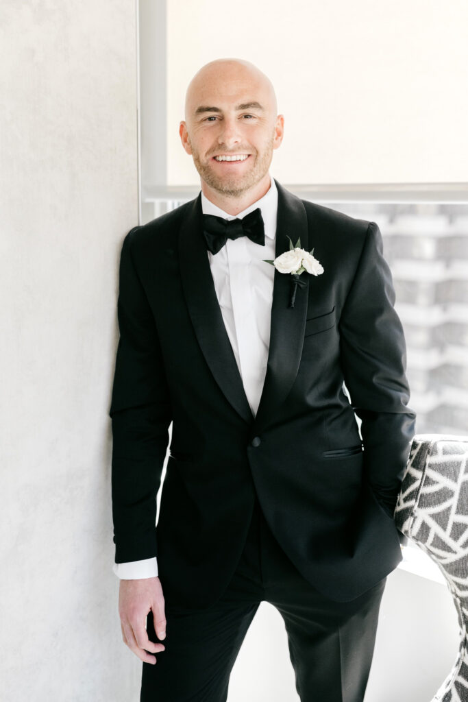 portrait of groom before Cescaphe summer wedding