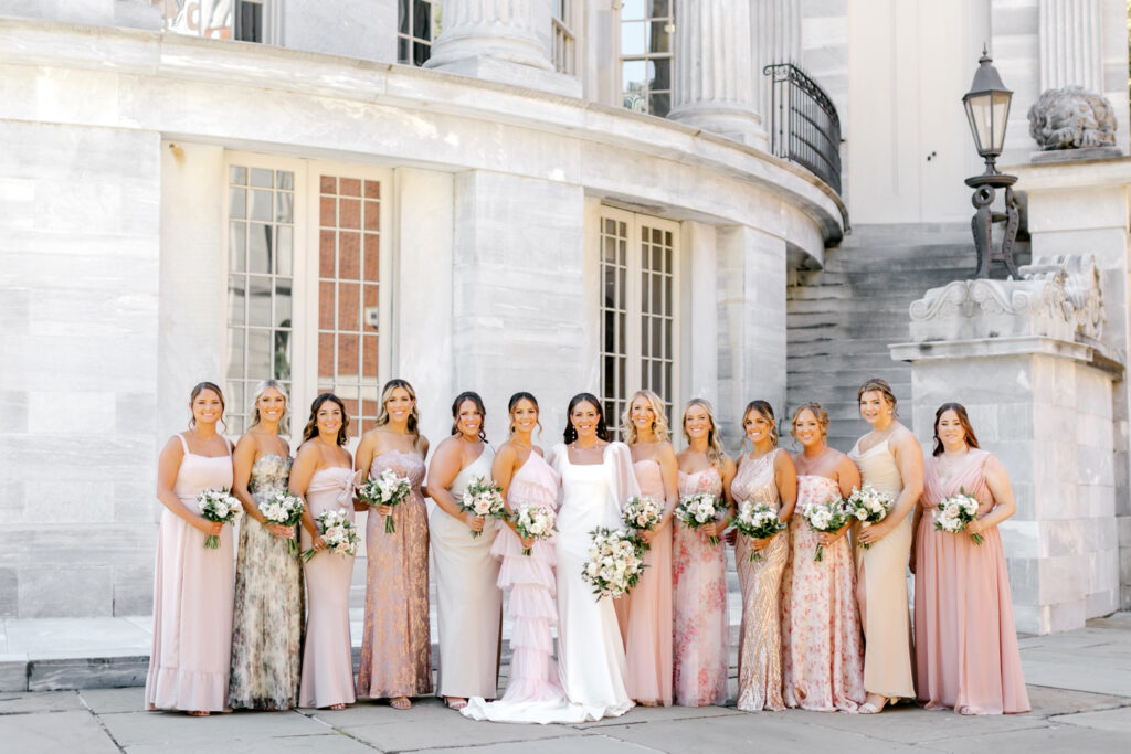 bride with her bridesmaids in mismatched pink and champagne bridesmaid dresses in Philadelphia, Pennsylvania