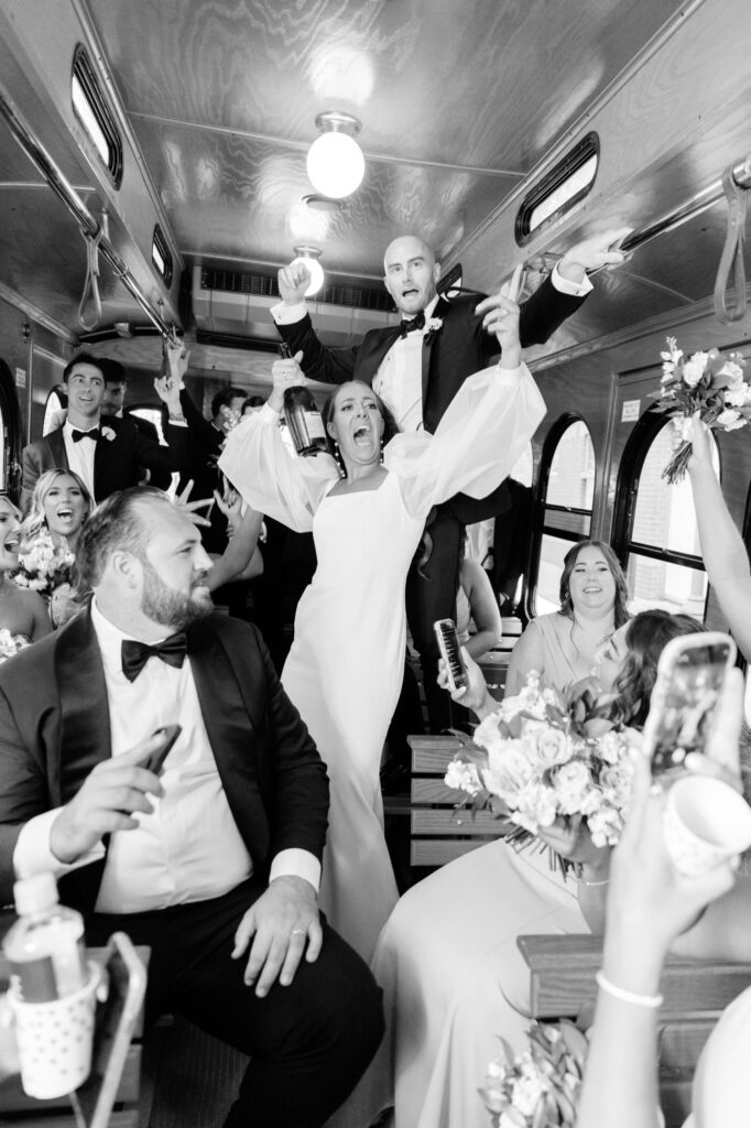 bridal party on party bus going to Cescaphe wedding reception by Emily Wren Photography