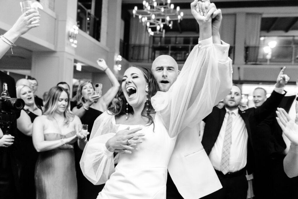 bride and groom having fun during their Cescaphe wedding reception