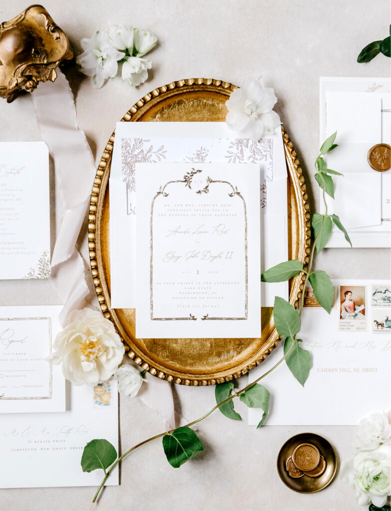 white and bronze wedding invite details by Emily Wren Photography