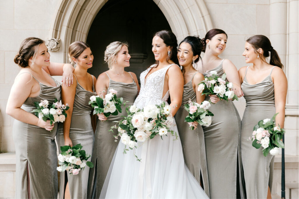 bride with bridesmaids in sage green velvet bridesmaid dresses