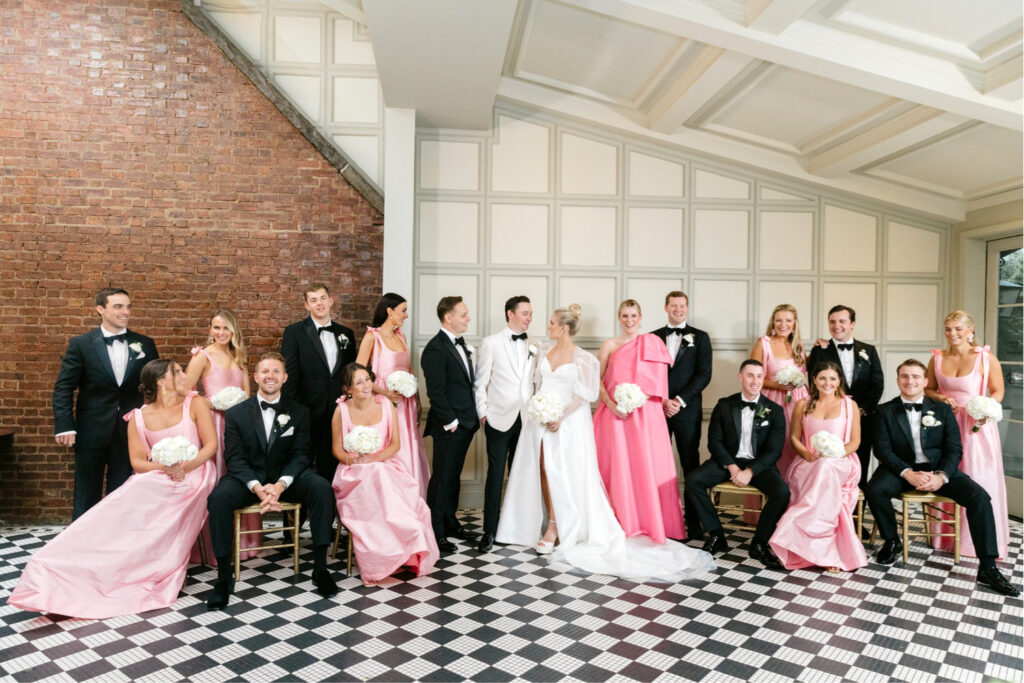 full bridal party dressed in black & pink