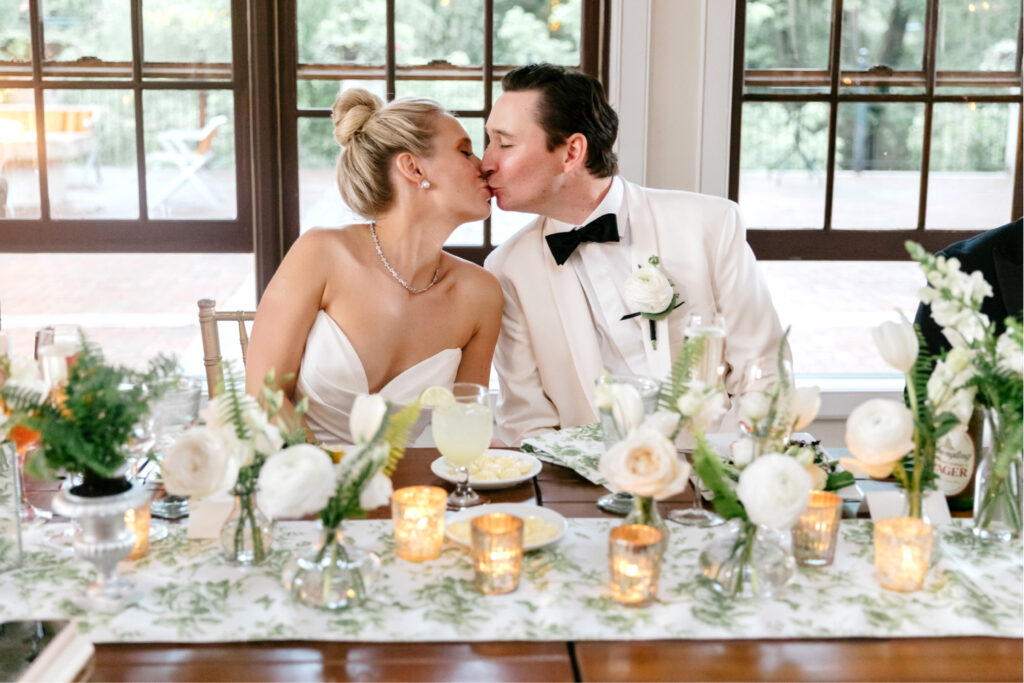 bride & groom at their sweetheart table during summer wedding reception in New Hope