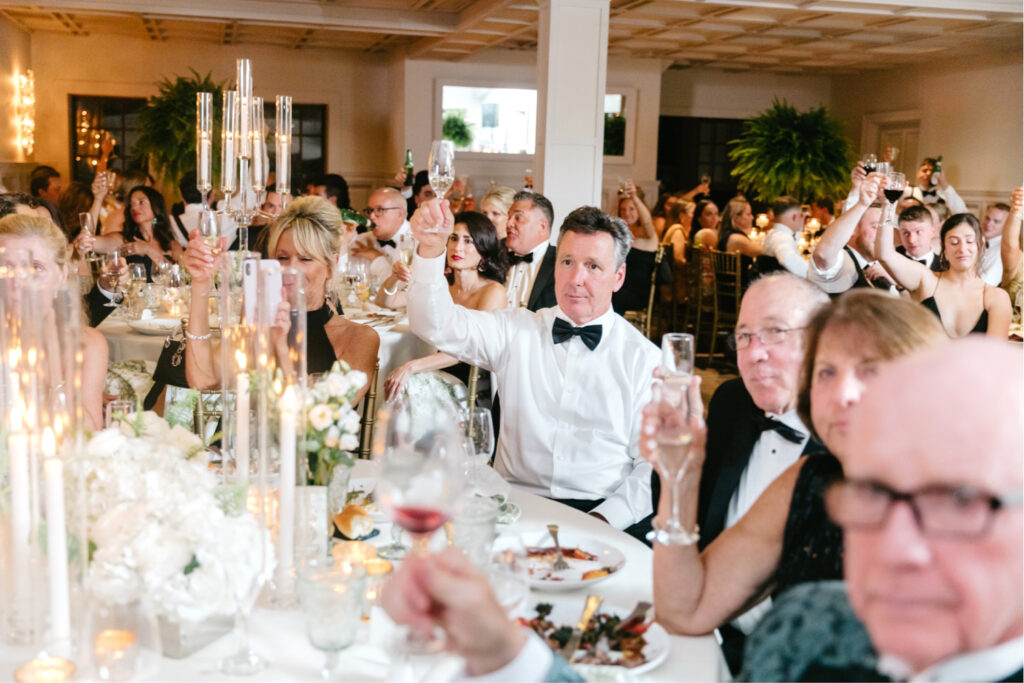 guests toasting during bridal party speeches at Hotel du Village wedding reception in New Hope Pennsylvania