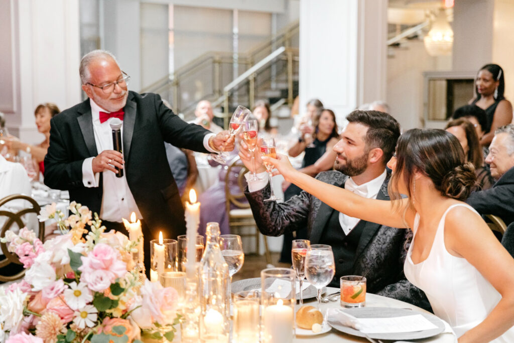 bride & groom during wedding reception toasts