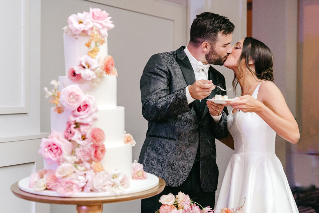 bride & groom cutting their 4 tier wedding cake at Cescaphe wedding reception