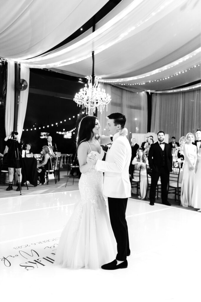 first dance at Cescaphe Water Works wedding reception under string light tent