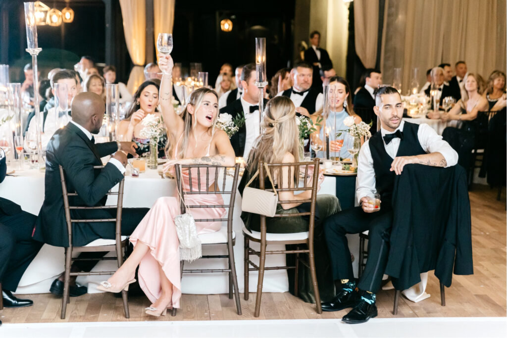 Wedding guests during reception speeches at Cescaphe Water Works