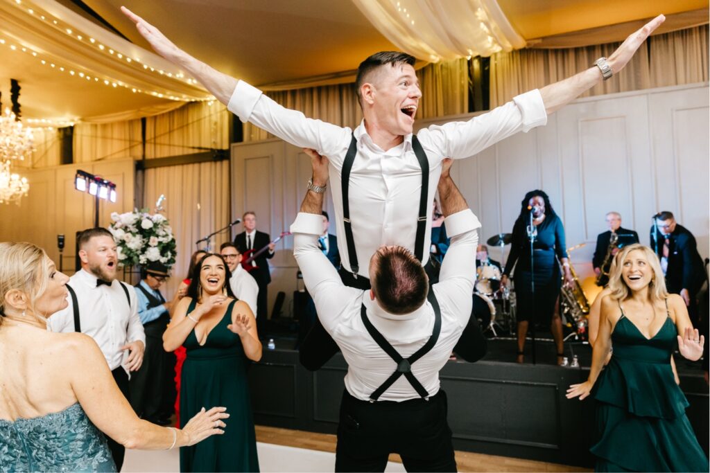 groom dancing during his Fall Cescaphe wedding reception at Philadelphia Water Works