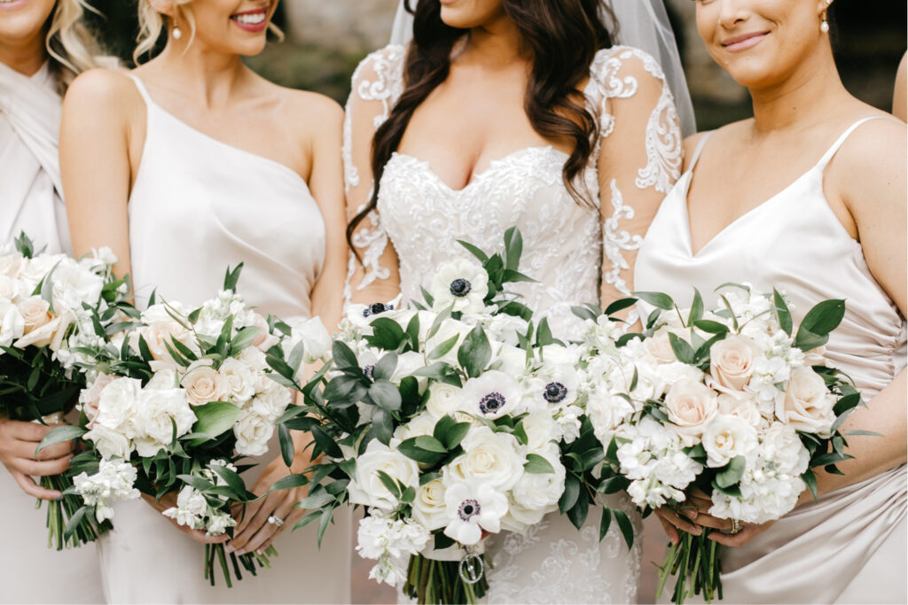 bride & bridesmaids bouquet made of poppy anemone's & roses by Emily Wren Photography