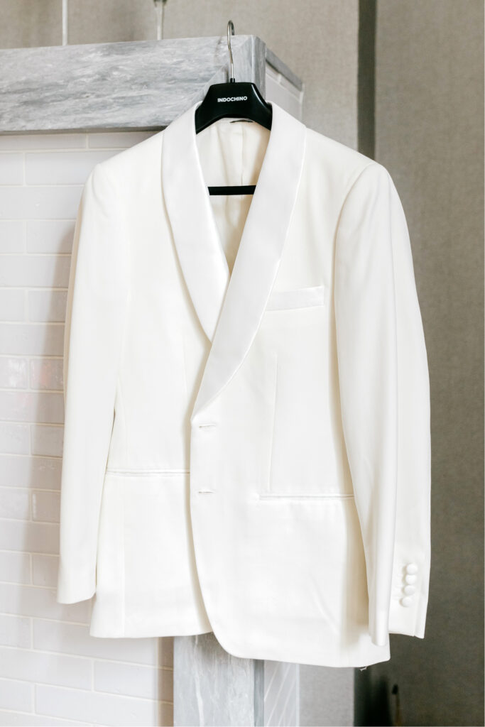 grooms white tux for his fall wedding day