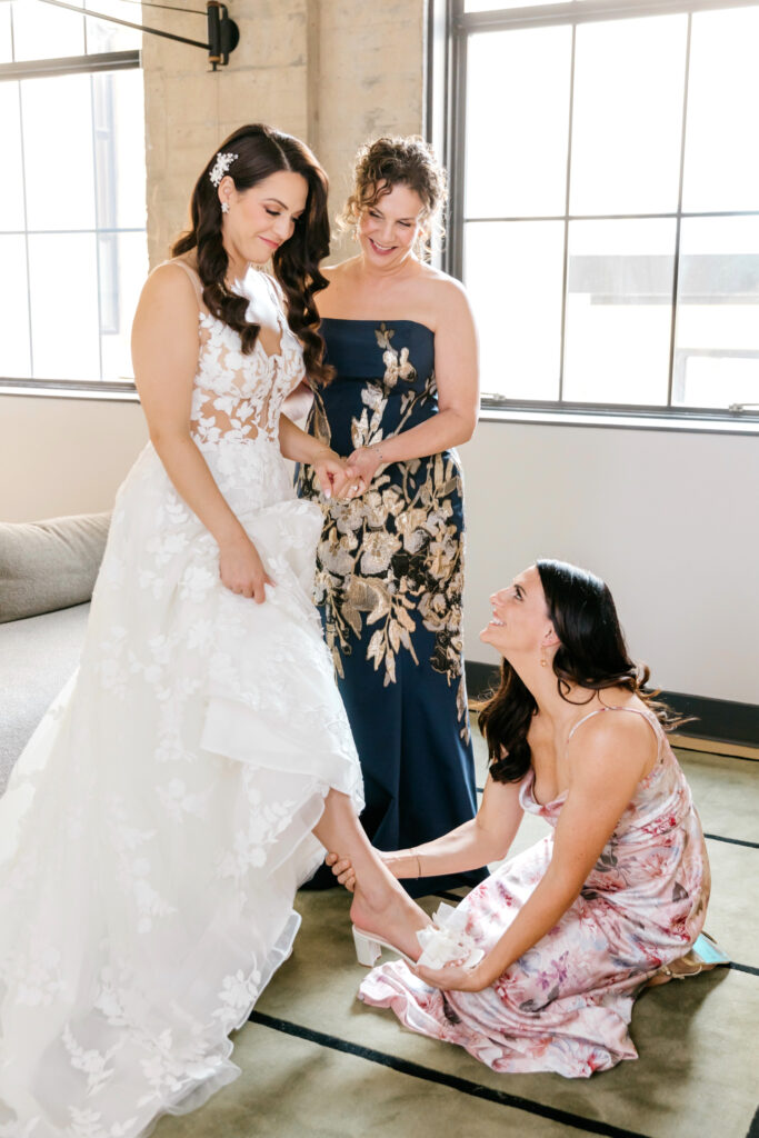 bride getting ready for her Cescaphe wedding by Emily Wren Photography