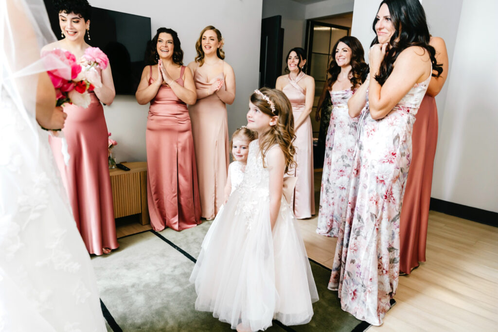 bridesmaids & flower girls first look at the bride