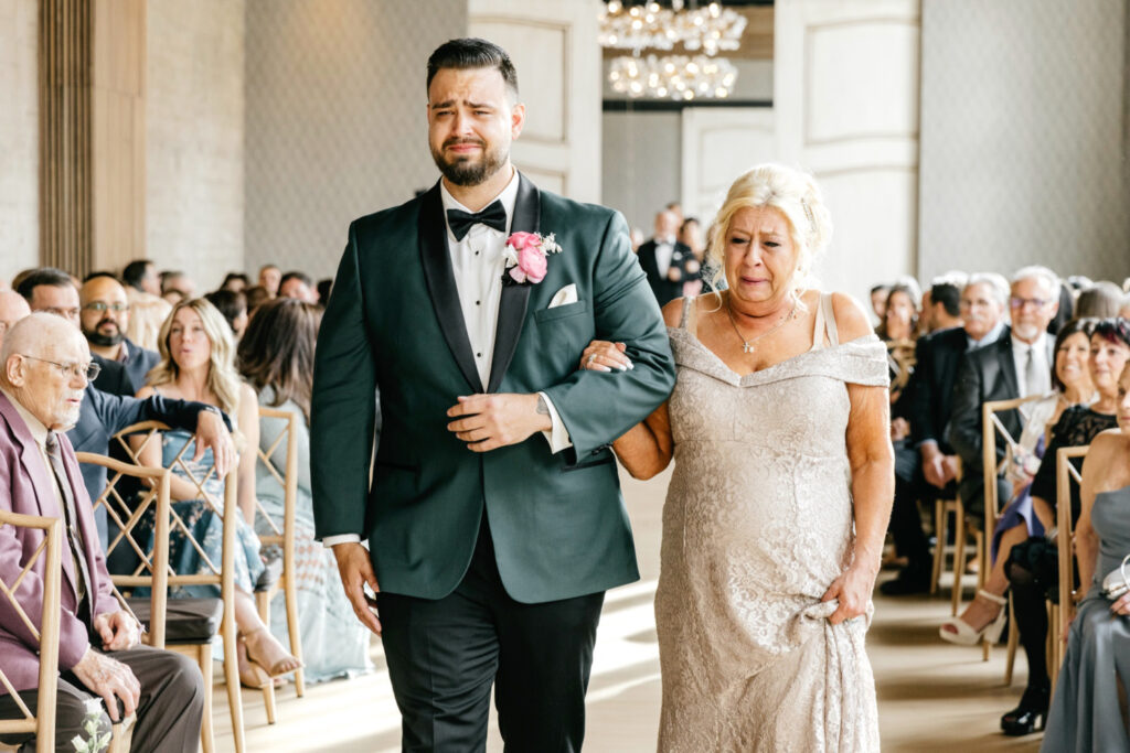 groom walking down the aisle with his mother at Cescaphe wedding