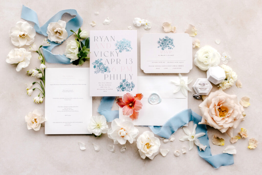 white & blue wedding invitations with holographic elements