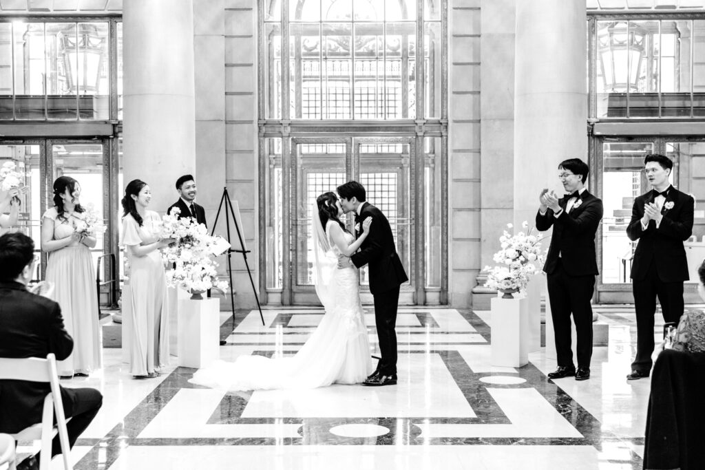 bride & groom first kiss at their spring wedding in Philadelphia, Pennsylvania by Emily Wren Photography