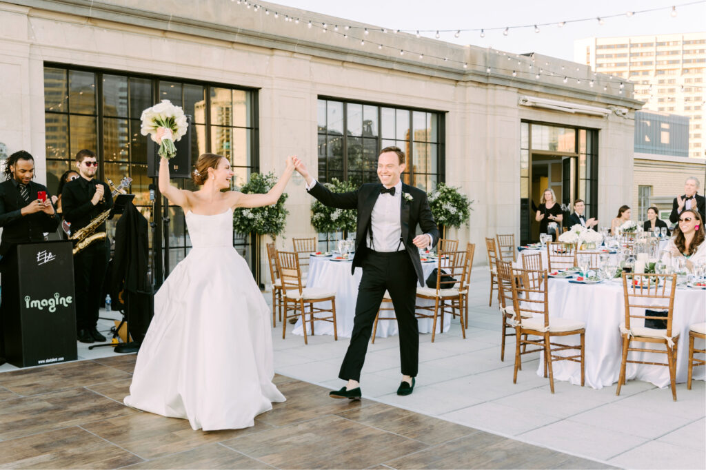 bride & grooms reception entrance during Philadelphia summer rooftop wedding