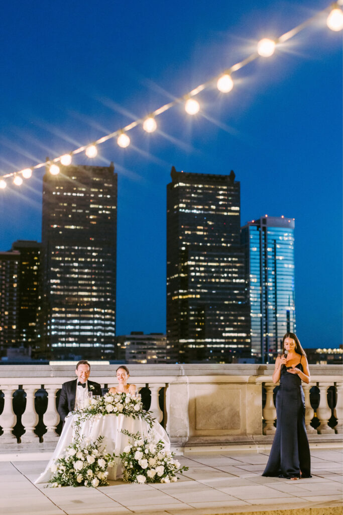 summer rooftop wedding reception with stunning Philadelphia cityscape in the background by Emily Wren Photography