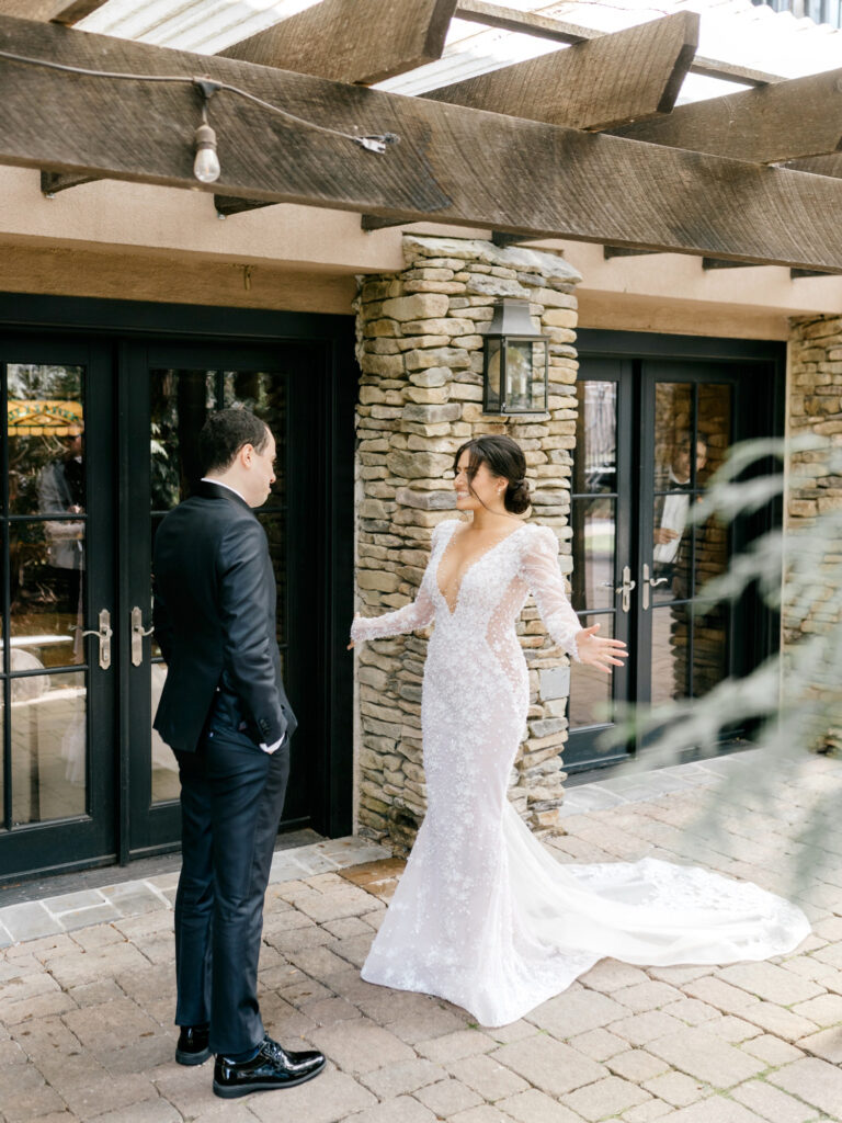 bride & groom's first look at The Lake House Inn by Emily Wren Photography
