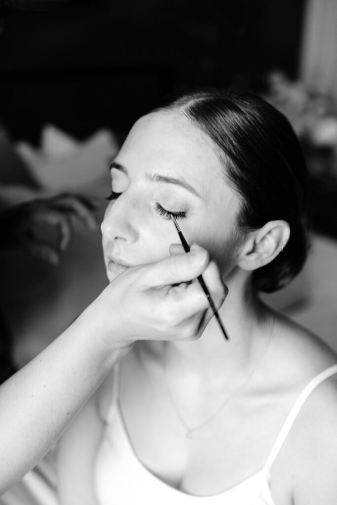 bride getting her makeup done before her fall Philadelphia wedding