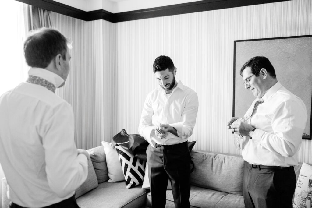 groom getting ready with his groomsmen before Pennsylvania wedding