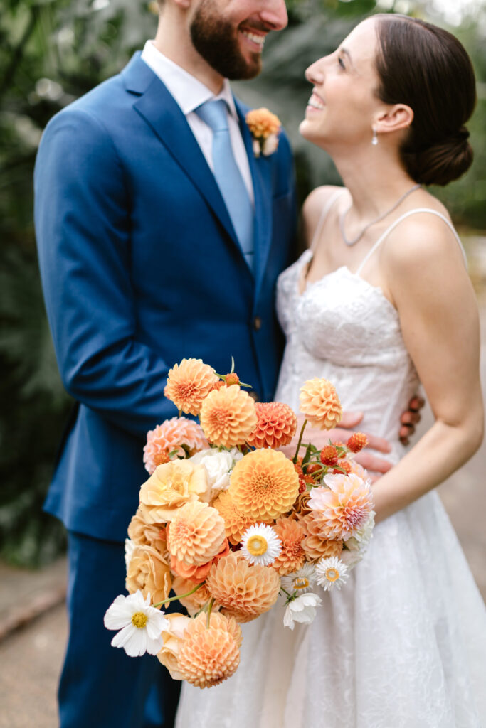 vibrant orange flowers & daisies bridal bouquet for fall wedding in Philadelphia