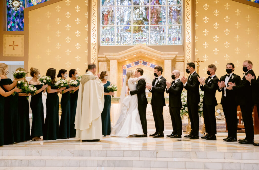 bride & grooms first kiss at Media, PA catholic church