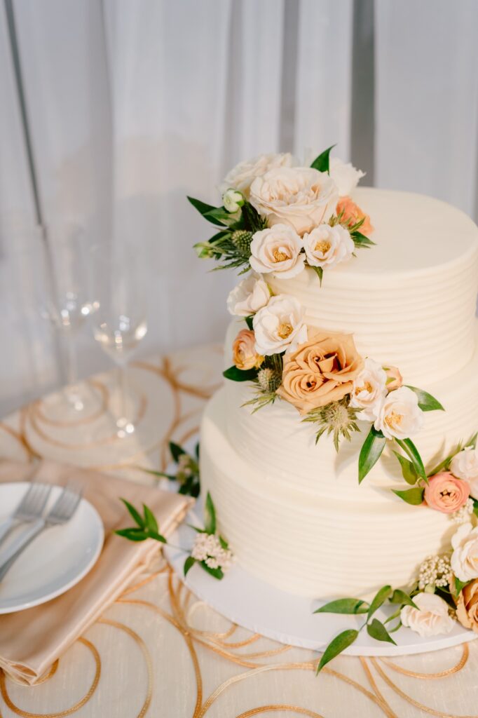 3 tier wedding cake with fall floral decor