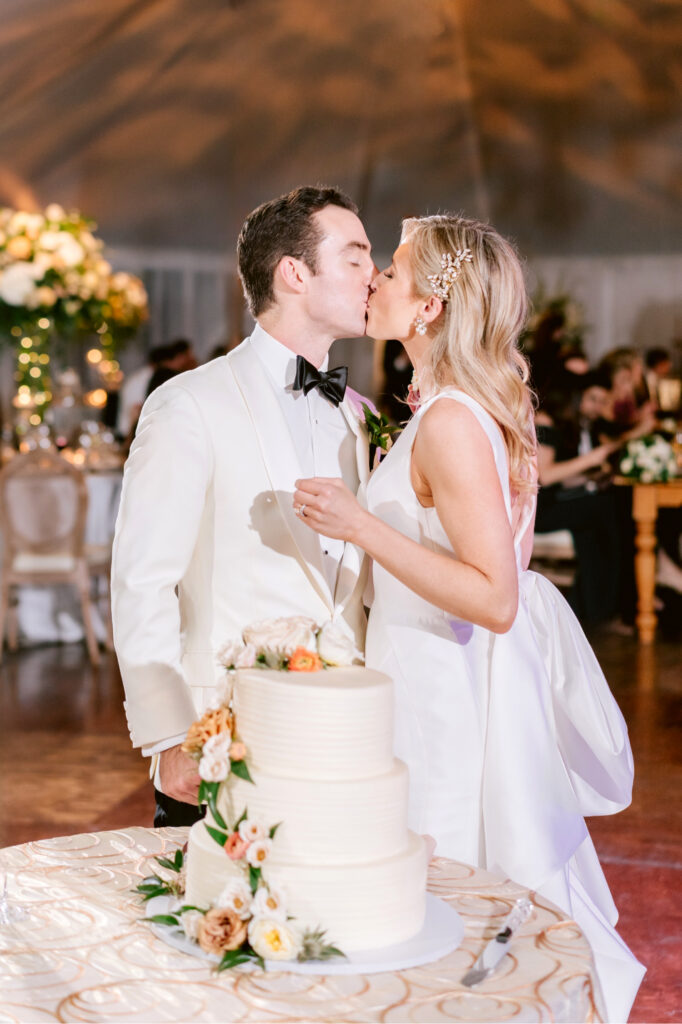 bride & groom cutting their wedding cake at their New Jersey Fall wedding reception by luxury wedding photographer Emily Wren Photography