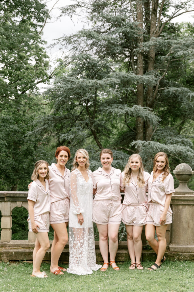 bride with bridesmaids before getting ready for her Pennsylvania garden wedding